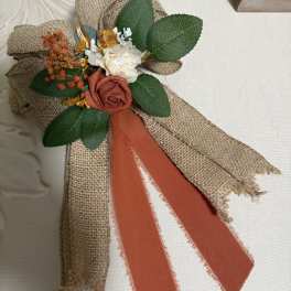Small burlap floral corsage with roses and ribbon