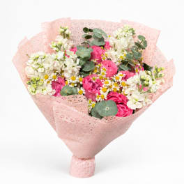 Pink and white mixed bouquet wrapped in pale pink paper