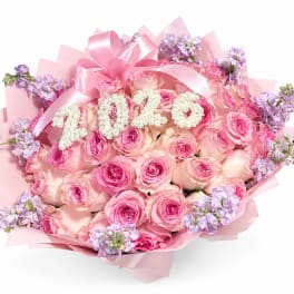 Pink rose bouquet with lavender accents and a large pink ribbon