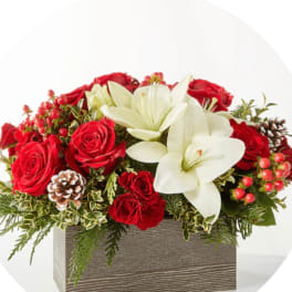 Red roses and white lilies in a rectangular wooden box