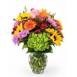 Colorful mixed bouquet in a clear glass vase