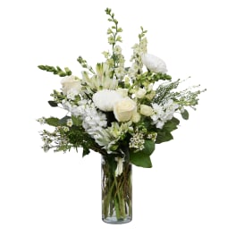 White floral arrangement in a clear glass vase