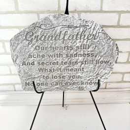 Memorial plaque on a black easel with a sympathy message