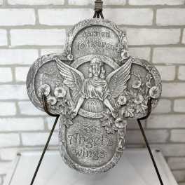 Decorative angel memorial plaque on a metal stand