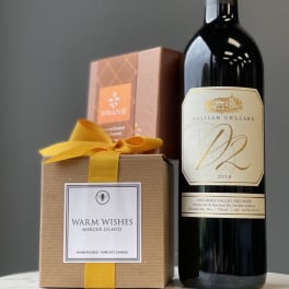 Gift set with a candle box and a bottle of red wine
