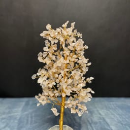 Wire gemstone tree with clear crystal chips on a faceted stone base