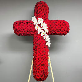 Red rose cross with white orchids on an easel