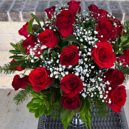 Bouquet of red roses with white baby's breath and greenery