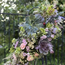 Succulent bouquet with pastel flowers and berries