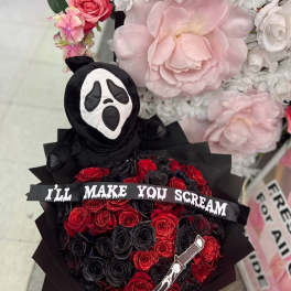 Black bouquet with red roses and a Ghostface plush topper