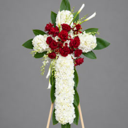 Standing floral cross with red roses and white flowers