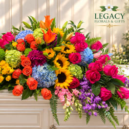 Large colorful floral arrangement with roses, sunflowers, and hydrangeas
