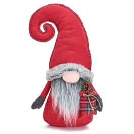 Red plush gnome with a tall curled hat and plaid gift bag