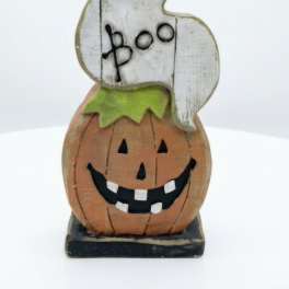 Wooden Halloween ghost and pumpkin stack figurine on a base