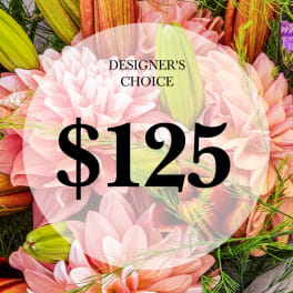Pink and peach flower arrangement with a $125 designer's choice label