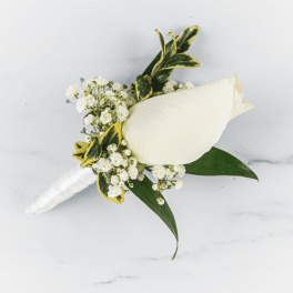 White calla lily bouquet with small white flowers and variegated leaves