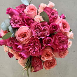 Bouquet of pink and peach roses with eucalyptus leaves