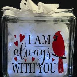 Clear gift box with white feathers and a red cardinal graphic reading "I AM always WITH YOU"