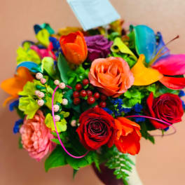 Colorful bouquet of roses and tulips with decorative accents