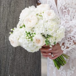 White bridal bouquet with roses and hydrangeas