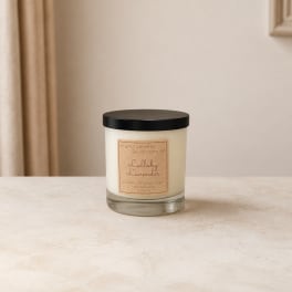 Lavender-scented candle in a glass jar with a black lid