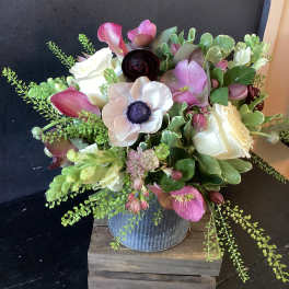 Bouquet of pink and white flowers in a metal vase