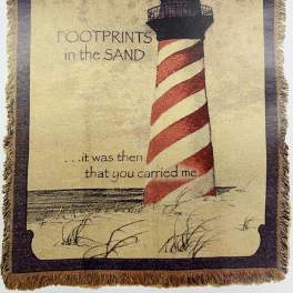 Decorative woven wall hanging with a lighthouse and printed text