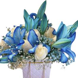 Blue and white floral arrangement in a lavender quilted box