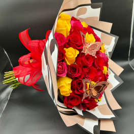 Bouquet of red and yellow roses with butterfly decorations