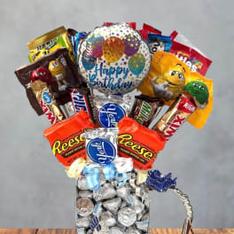 Blue Birthday candy bouquet in pretty tea glass