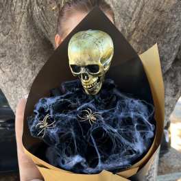 Halloween bouquet with a skull topper and black spiderweb accents