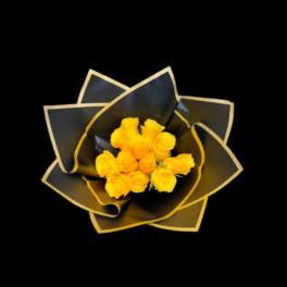 Yellow roses wrapped in black paper with gold trim