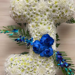 Letter J tribute of white mums with bright blue roses and orchids on a neutral background