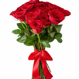 Hand-tied bouquet of red roses with a red satin ribbon bow