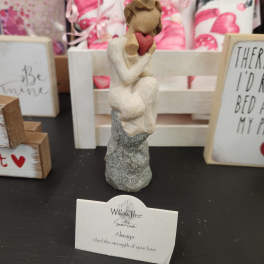 Small Willow Tree figurine of a seated figure holding a red heart