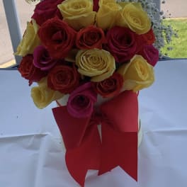 Yellow,red and pink roses along side baby breath arrangement by lav.ishbouquets