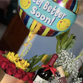 Red roses and yellow Alstroemeria, baby breath arrangement in a gold heart box by lav.ishbouquets