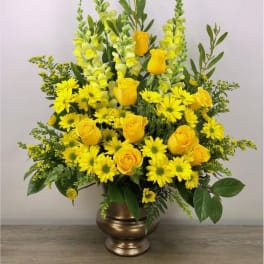 Tall yellow rose and daisy arrangement with snapdragons in a bronze urn vase