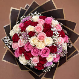 Bouquet of pink, red, and white roses with baby's breath
