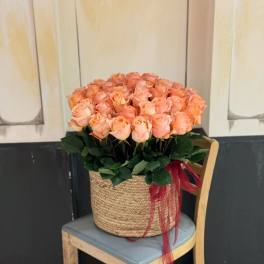 bouquet of fifty orange roses in a basket