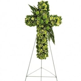 Green floral standing cross on an easel