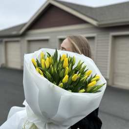 a bouquet of forty delicate yellow tulips