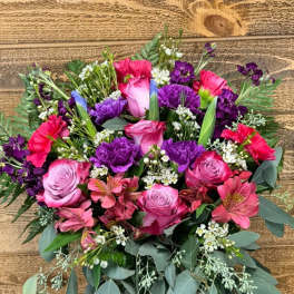 Bouquet of pink and purple flowers in a glass vase