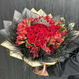 Bouquet of red roses and pink alstroemeria with a jeweled tiara