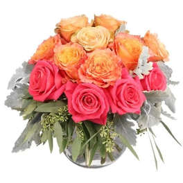 Bouquet of pink and peach roses in a glass vase