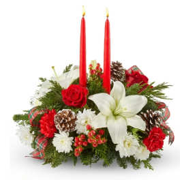 Christmas centerpiece with red candles, white lilies, and red roses