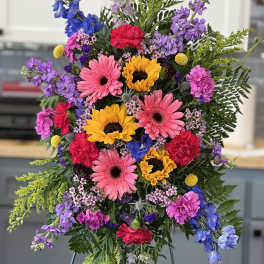 Bright mixed bouquet with sunflowers, pink gerberas, and purple flowers