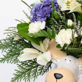 Bouquet with purple and white flowers and a teddy bear face