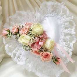 White lace bouquet with pink and cream roses and ribbon