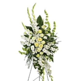 Tall white and pale yellow floral standing spray on an easel